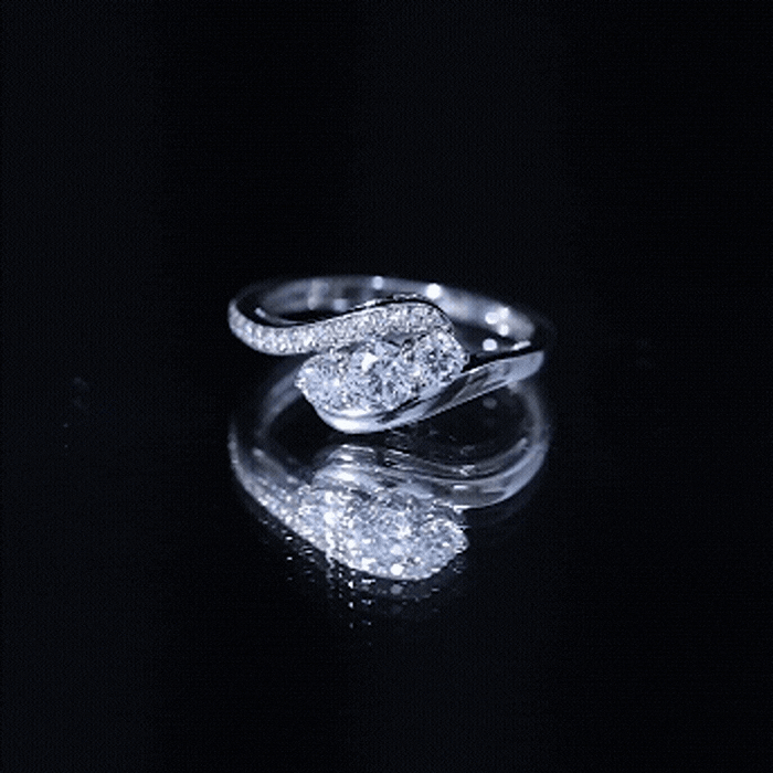 Yellow gold three stone moissanite engagement ring with bypass shank by Rosec Jewels, showcasing sparkling gemstones and elegant design.