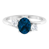 6X8mm Oval Cut London Blue Topaz Three Stone Engagement Ring with Diamond