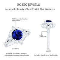 Lab grown 2.7 carat blue sapphire flower engagement ring with diamonds, crafted by Rosec Jewels, featuring intricate floral design.