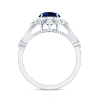 Rosec Jewels blue sapphire flower engagement ring featuring a 2.7 carat lab-grown sapphire and diamond accents.
