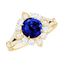 Lab grown blue sapphire flower engagement ring with diamonds, featuring a 2.7 carat blue sapphire center and intricate floral design.