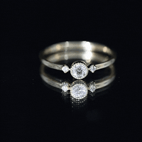 Yellow gold minimal diamond promise ring in bezel setting by Rosec Jewels, featuring a sleek design with a central diamond.