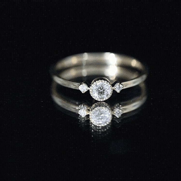Yellow gold minimal diamond promise ring in bezel setting by Rosec Jewels, featuring a sleek design with a central diamond.