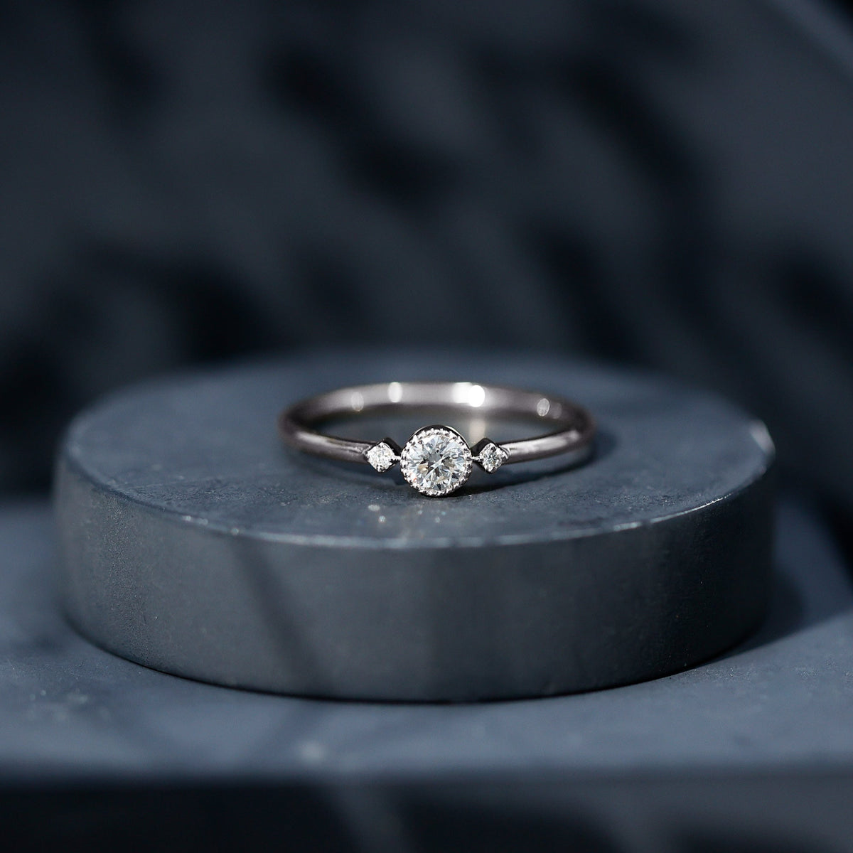 Minimal diamond promise ring in bezel setting by Rosec Jewels, showcasing a sleek design with a sparkling diamond centerpiece.