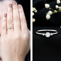 Minimal diamond promise ring in bezel setting by Rosec Jewels, featuring a sleek band with a central sparkling diamond.