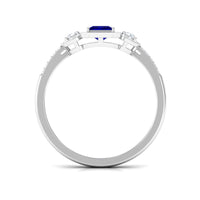 Blue sapphire princess cut engagement ring with diamond accents, featuring a rose gold band from Rosec Jewels.