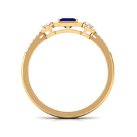 Princess cut blue sapphire engagement ring with diamonds by Rosec Jewels, featuring a prominent blue sapphire centerpiece and diamond accents.