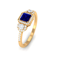 Blue sapphire princess cut engagement ring with diamonds from Rosec Jewels, featuring a prominent blue sapphire gemstone and sparkling accents.