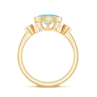 Bezel set aquamarine and diamond engagement ring by Rosec Jewels, featuring a central aquamarine with side diamonds in a sleek band