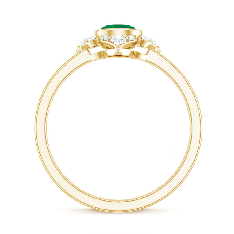 Natural bezel set 5mm emerald flower engagement ring with diamond from Rosec Jewels, showcasing detailed floral design and sparkling accents.