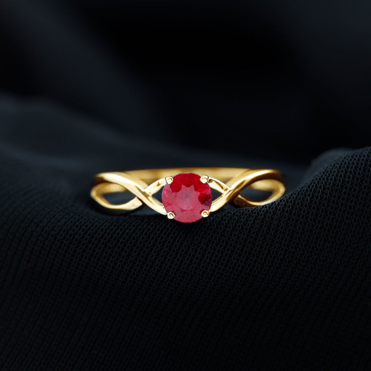 Natural 0.6 carat ruby promise ring with crossover shank from Rosec Jewels, featuring a vibrant red ruby gemstone and elegant design.