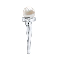 Freshwater pearl solitaire crossover engagement ring with diamond by Rosec Jewels, showcasing a sleek design and sparkling accents.