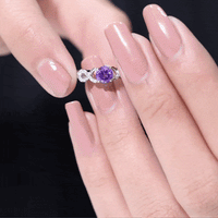 Natural amethyst engagement ring with a diamond infinity knot setting, designed by Rosec Jewels, featuring a central purple gemstone.