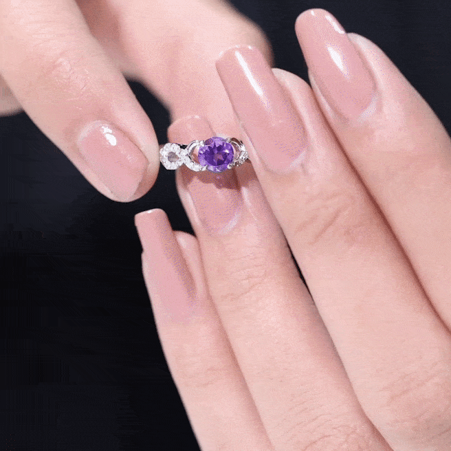 Natural amethyst engagement ring with diamond infinity knot from Rosec Jewels, featuring a yellow band and elegant gemstone setting.
