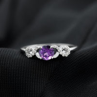 Natural amethyst engagement ring with diamond infinity knot detail from Rosec Jewels, showcasing a purple gemstone and intricate design.