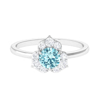 Rosec Jewels aquamarine and diamond flower engagement ring with round aquamarine center stone and sparkling diamonds.