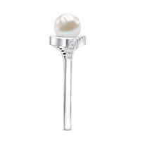 Freshwater pearl solitaire bypass engagement ring with diamond accent by Rosec Jewels, featuring a sleek design and elegant pearl centerpiece.