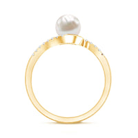 Freshwater pearl solitaire bypass engagement ring with diamond accent by Rosec Jewels, showcasing elegant white pearl and sparkling detail.
