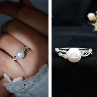 Genuine 7.4 carat freshwater pearl engagement ring with diamond crossover shank by Rosec Jewels, featuring a lustrous pearl and sparkling diamonds.