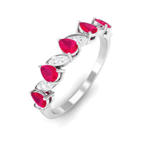 Pear-shaped ruby half eternity ring with diamonds for women, featuring rose gold band and intricate detailing by Rosec Jewels.