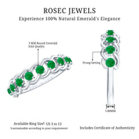 Genuine green emerald braided half eternity ring by Rosec Jewels, featuring a detailed design and vibrant emerald stones.