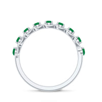 Genuine green emerald braided half eternity ring by Rosec Jewels featuring alternating emeralds and intricate braided design.