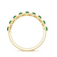 Genuine green emerald braided half eternity ring by Rosec Jewels featuring a continuous band of green emeralds and intricate braid design.