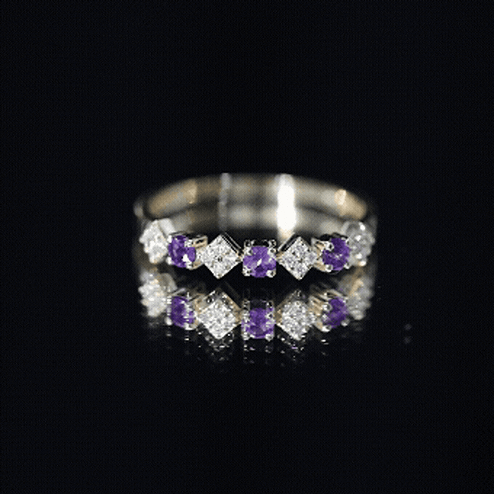 Real amethyst half eternity ring with diamonds for women, featuring yellow gold band and intricate gemstone setting.
