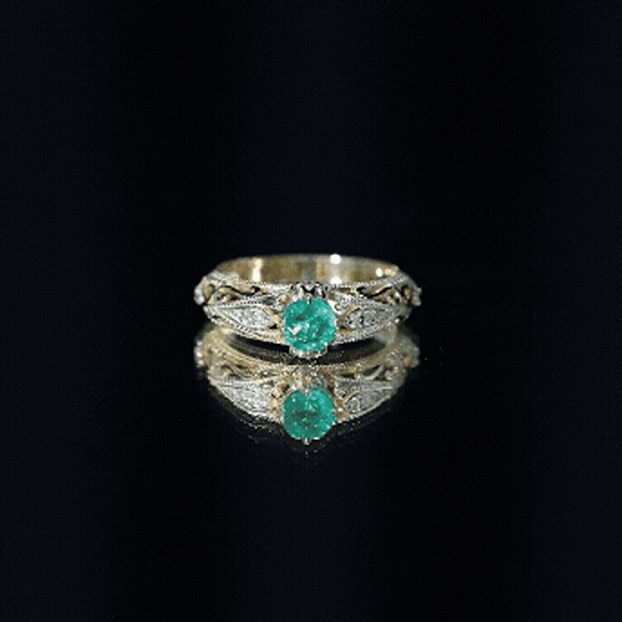 Antique-style engagement ring with natural emerald and diamond accents, crafted by Rosec Jewels, showcasing intricate vintage design.