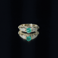 Antique-style engagement ring with natural emerald and diamond accents, crafted by Rosec Jewels, showcasing intricate vintage design.