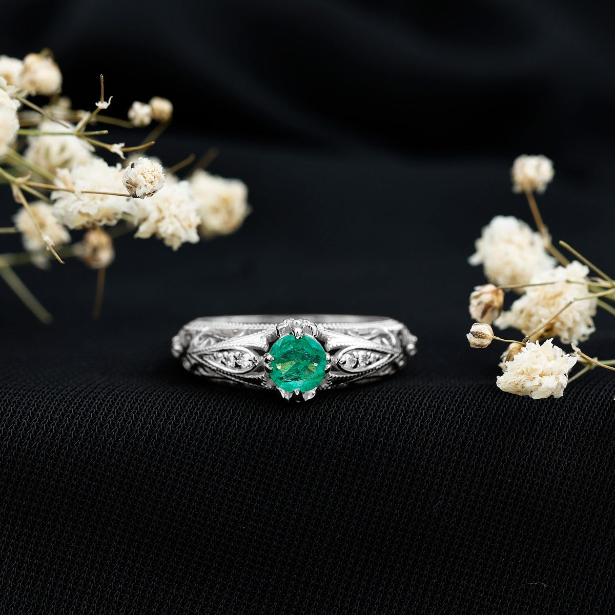 Natural emerald and diamond antique-style engagement ring with intricate detailing from Rosec Jewels.