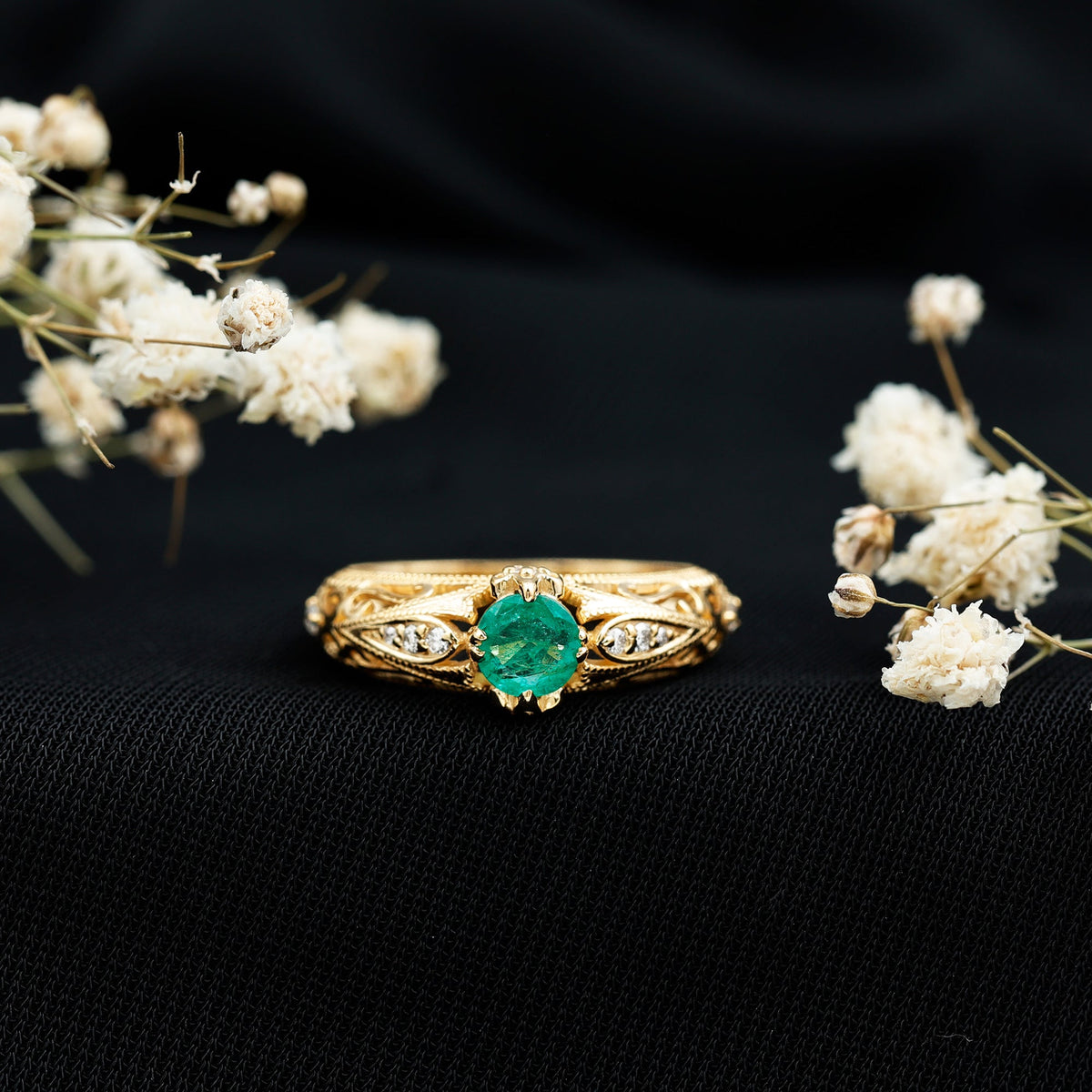 Natural emerald and diamond antique-style engagement ring by Rosec Jewels featuring intricate gold band and vintage-inspired design.