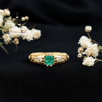 Natural emerald and diamond antique-style engagement ring by Rosec Jewels featuring intricate gold band and vintage-inspired design.