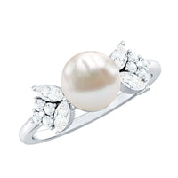 Nature-inspired 3-carat freshwater pearl engagement ring with diamonds by Rosec Jewels, featuring elegant floral design and sparkling accents.