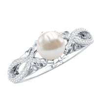 Cultured 2 Carat freshwater pearl solitaire engagement ring with diamond crossover shank by Rosec Jewels, showcasing elegant design.