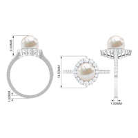 Freshwater pearl and diamond halo engagement ring by Rosec Jewels featuring a central pearl surrounded by sparkling diamonds.