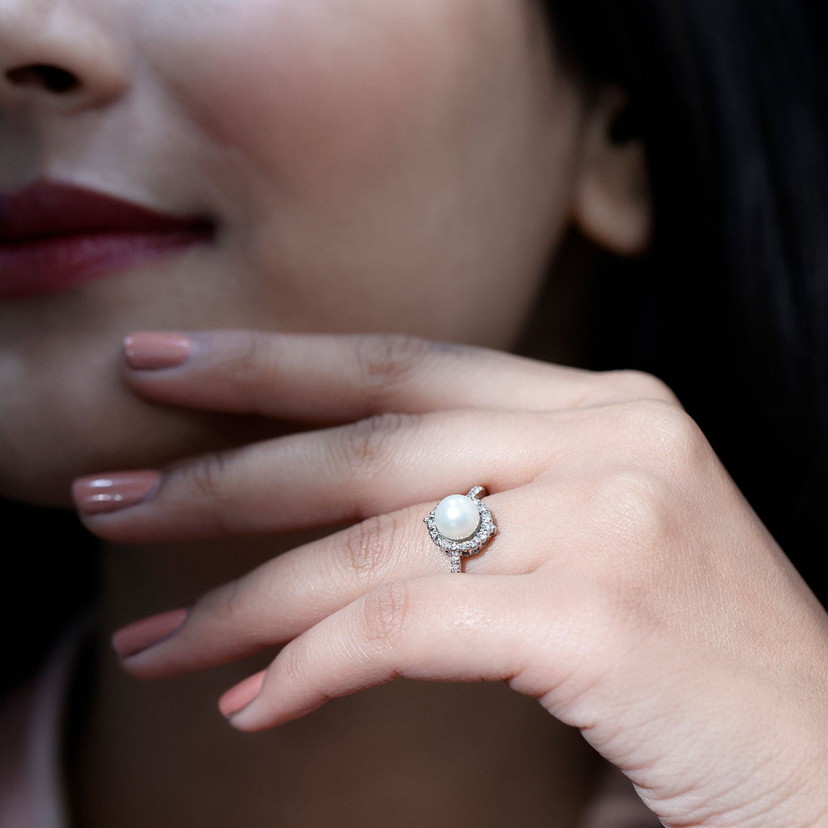 Freshwater pearl and diamond halo engagement ring by Rosec Jewels, showcasing a elegant pearl center with sparkling diamond accents.