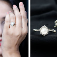 Freshwater pearl and diamond halo engagement ring by Rosec Jewels, showcasing a sparkling center with elegant design.