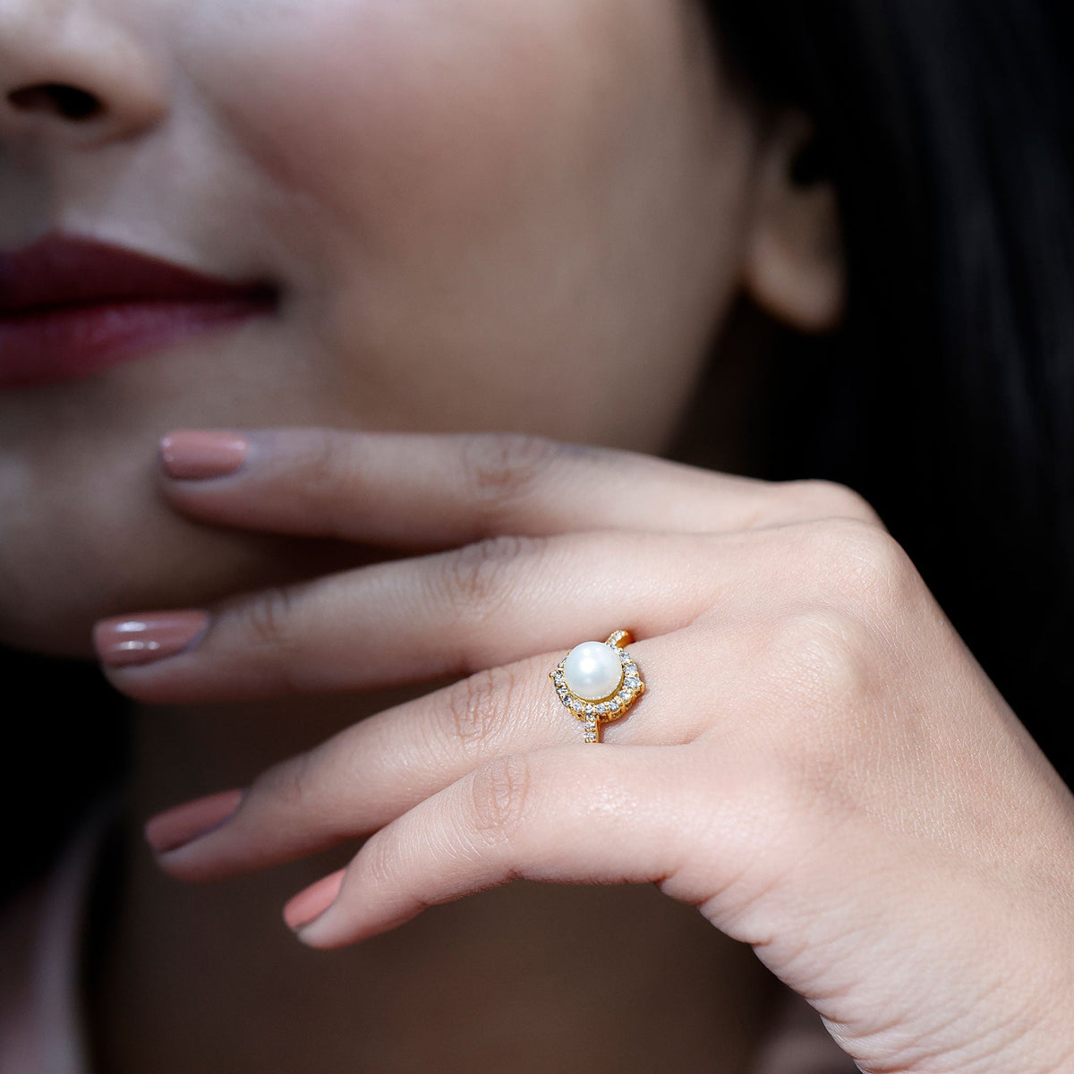 Freshwater pearl and diamond halo engagement ring from Rosec Jewels, featuring a central pearl surrounded by sparkling diamonds.