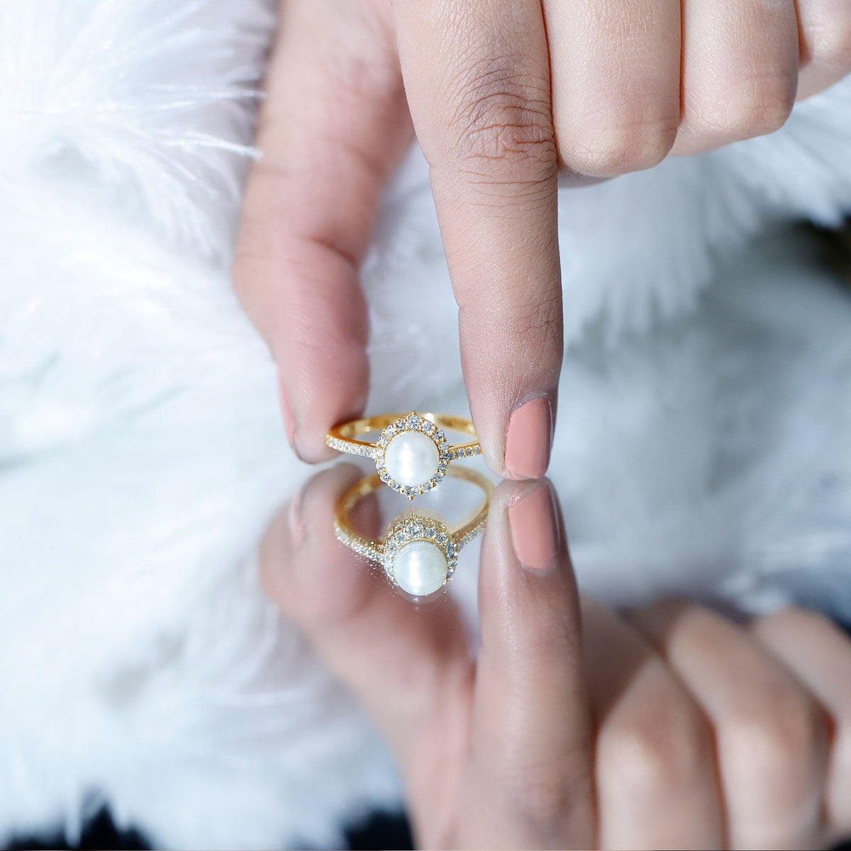 Freshwater pearl and diamond halo engagement ring by Rosec Jewels featuring a central pearl surrounded by sparkling diamonds.