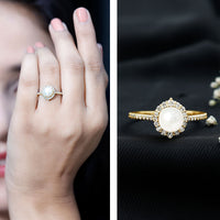 Freshwater pearl and diamond halo engagement ring by Rosec Jewels featuring a central pearl surrounded by sparkling diamonds.