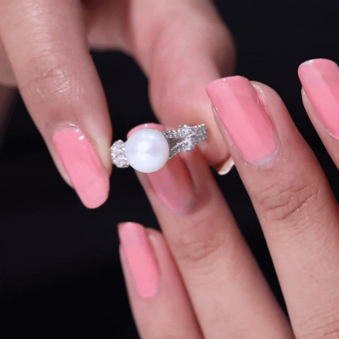 Rosec Jewels cultured 7.4 carat freshwater pearl engagement ring with lab diamonds, featuring a yellow gold band and intricate design.