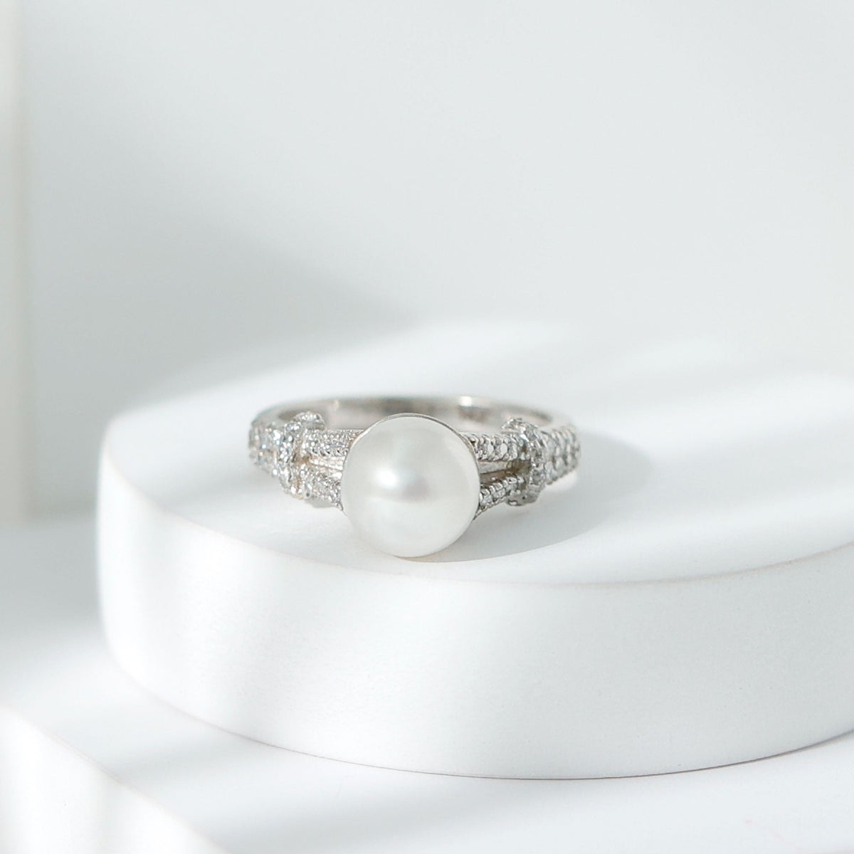 Rosec Jewels cultured 7.4 carat freshwater pearl engagement ring with lab diamond accents, featuring a sleek band and elegant design.