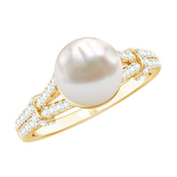 Cultured 7.4 carat freshwater pearl engagement ring with lab diamonds, featuring a rose gold band and intricate design.