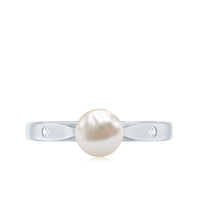 Natural 2 Carat freshwater pearl solitaire ring with diamond accent from Rosec Jewels, showcasing a elegant pearl centerpiece with delicate band.