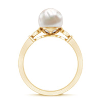 Rosec Jewels cultured 7.4 carat freshwater pearl diamond engagement ring with split shank design, showcasing elegant craftsmanship.