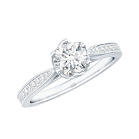Rosec Jewels Lotus Basket set cubic zirconia engagement ring with side stones, featuring a detailed floral-inspired design.