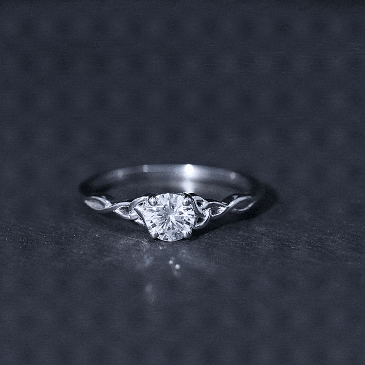 Rosec Jewels 0.5 carat solitaire cubic zirconia promise ring featuring a Celtic knot design, silver-tone and elegant craftsmanship.