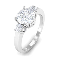 Round cubic zirconia three-stone engagement ring from Rosec Jewels with a silver band and sparkling stones.