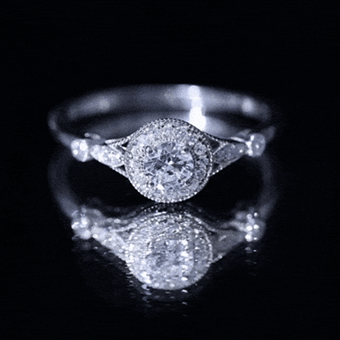 Antique-inspired zircon halo engagement ring from Rosec Jewels featuring a central stone surrounded by smaller zircon accents.
